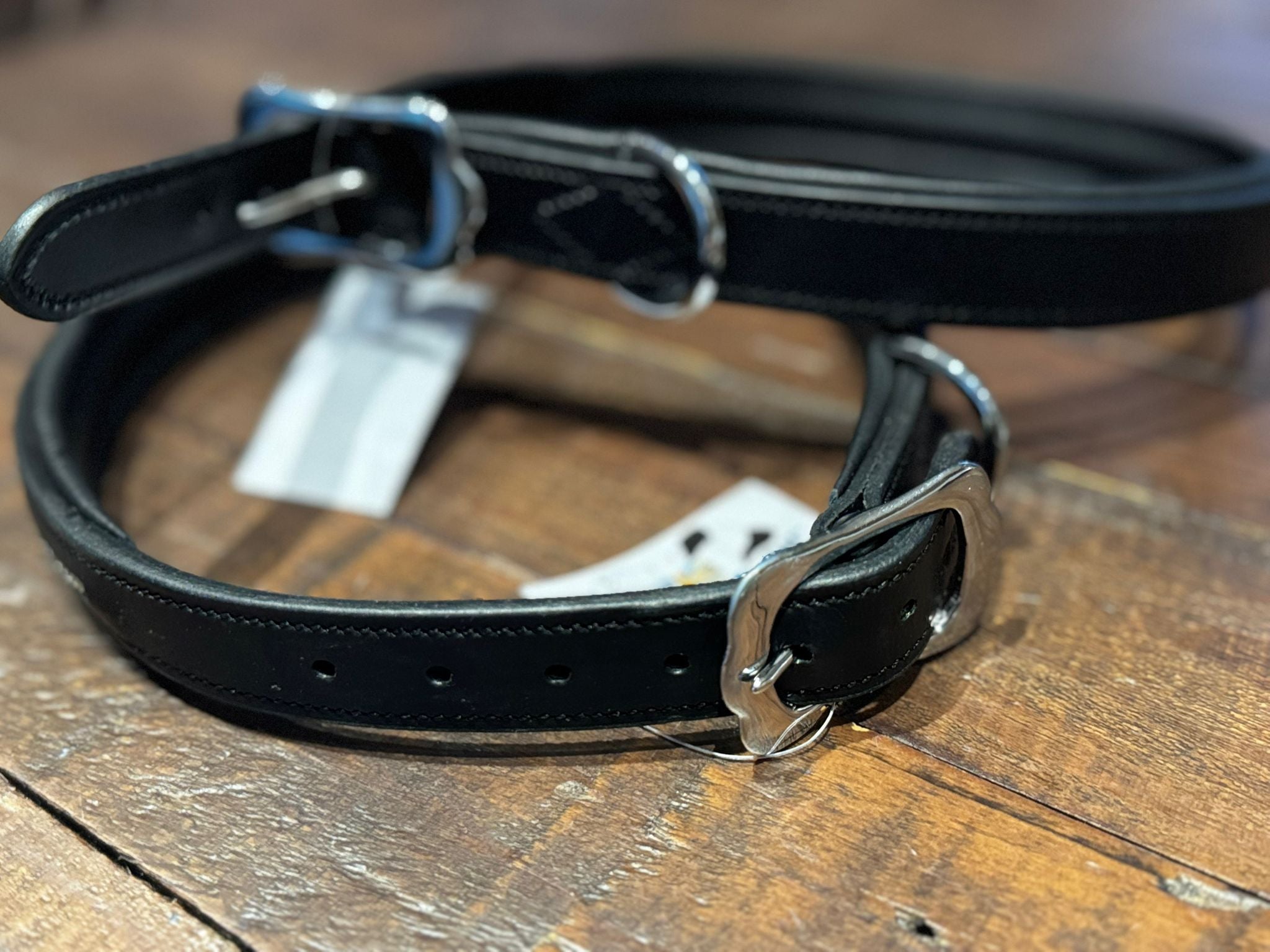 A black leather figure of 8 head collar, with silver buckle