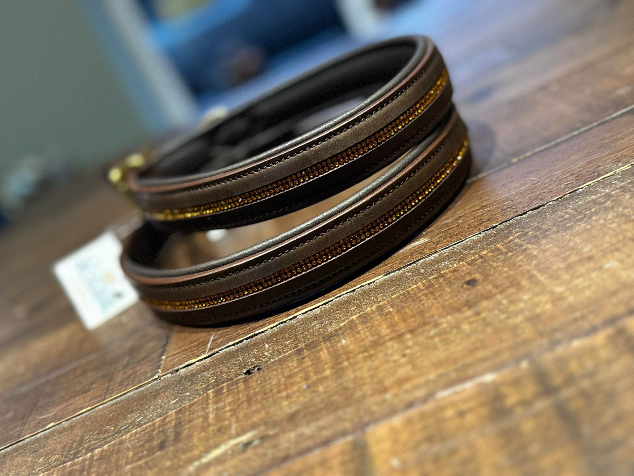 A brown leather figure of 8 head collar, embellished with handcrafted gold rhinestones