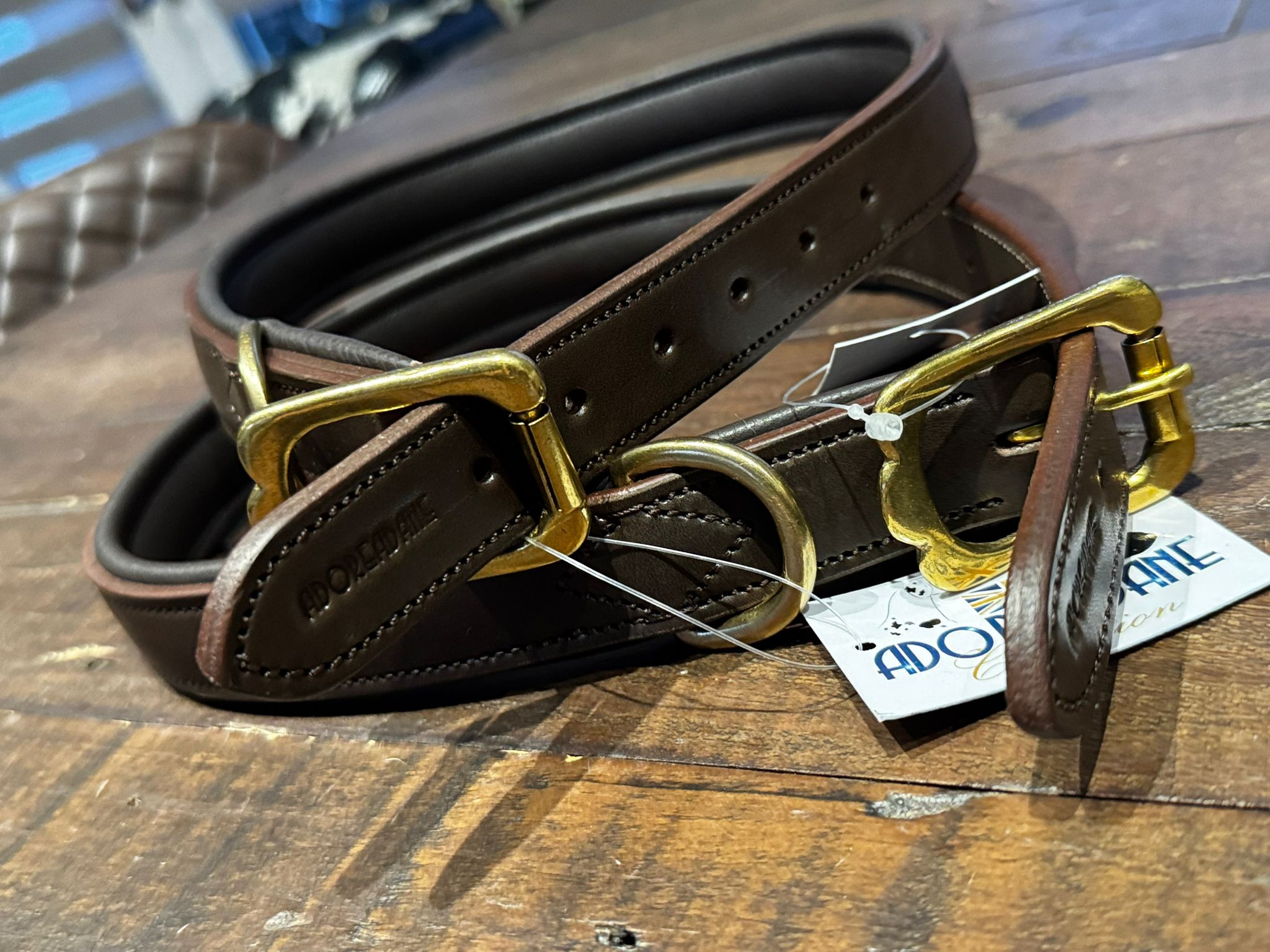 A brown leather figure of 8 head collar, with a gold buckle